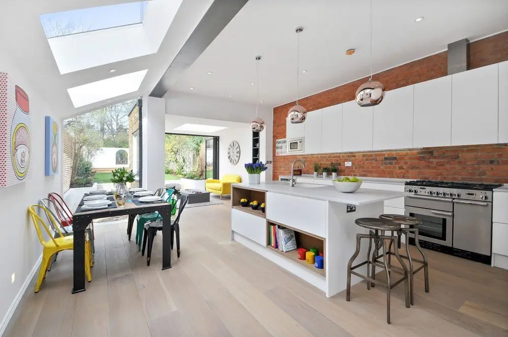 Bright, well-composed photograph of a small en-suite bathroom in a UK property